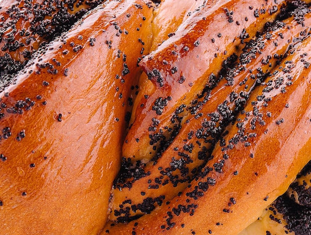 Bread with poppy seeds close up background