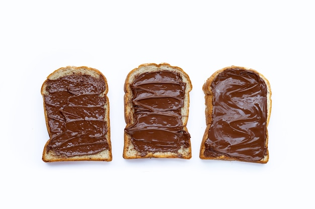 Bread with sweet chocolate hazelnut on white background.