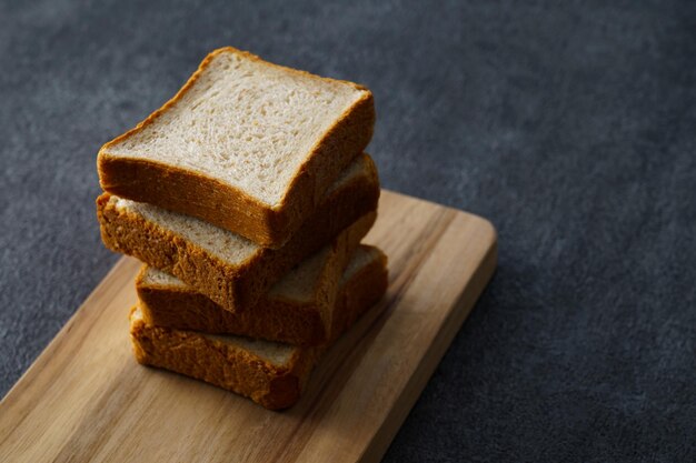 Bread with whole grains placed on a cutting board