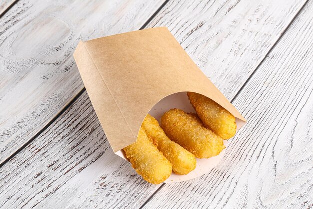 Photo breaded crispy cheese sticks snack appetizer