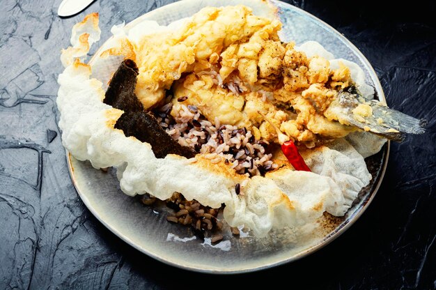 Breaded fish and cooked rice