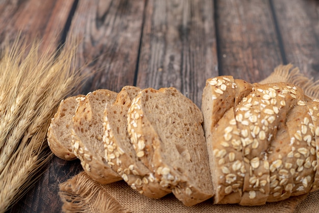 Breads sliced and wheat on the sack