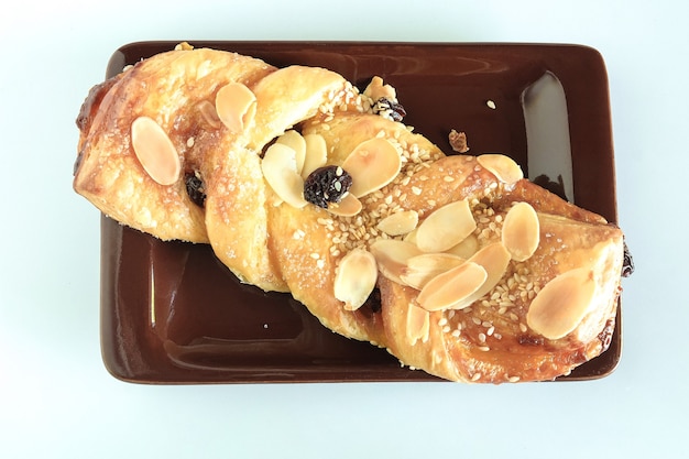 Breads with a golden crust on background.