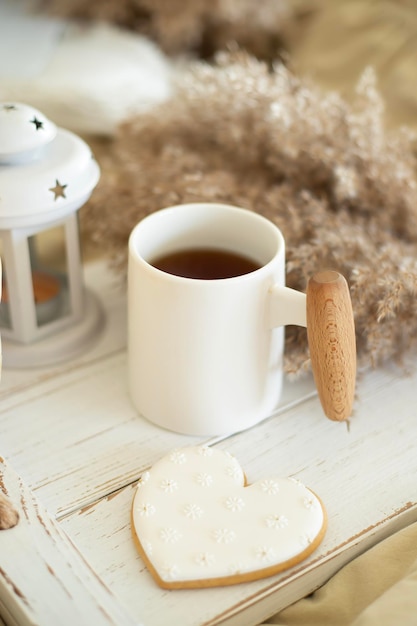 Breakfast in bed A cup of tea and goodies on a tray