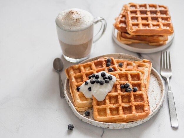 Breakfast belgian waffles cappuccino Copy space