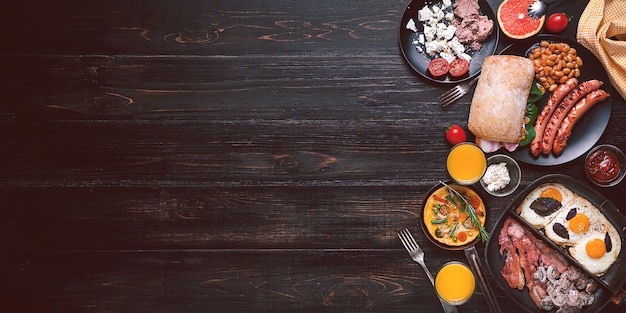 Breakfast on a black wooden table in rustic style