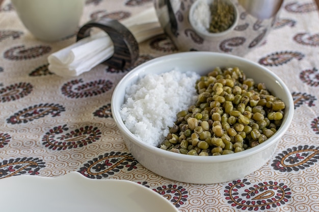 Breakfast bowl mung beans with fresh shredded coconut