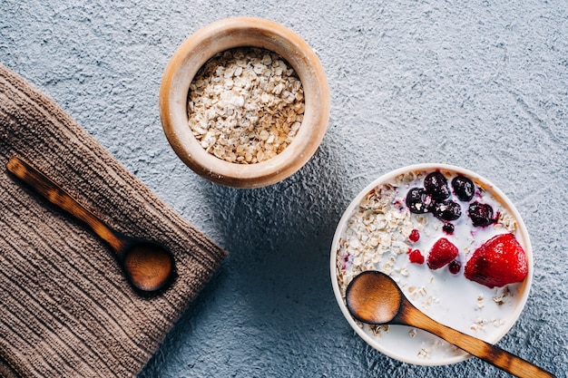 Breakfast. Bowl of oat milk with oat flakes and berries. Vegan food. Health day