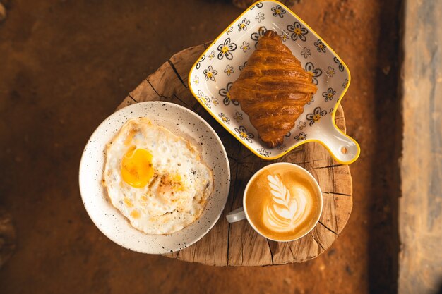 Breakfast, bread, coffee and fried eggs Breakfast on the plate