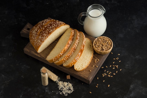 Breakfast bread with milk on cutting board