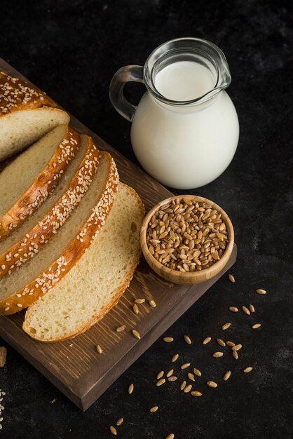 Breakfast bread with milk on cutting board