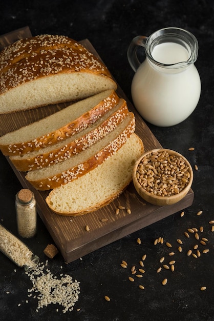 Breakfast bread with milk on cutting board