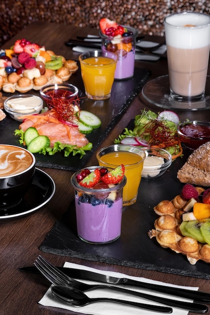 Breakfast or brunch set for two person on rustic wooden table