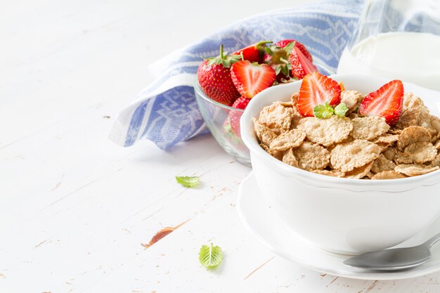 Breakfast - cereal and berries in white bowl