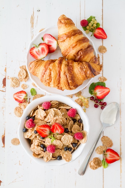 Breakfast - cereal and berries in white bowl