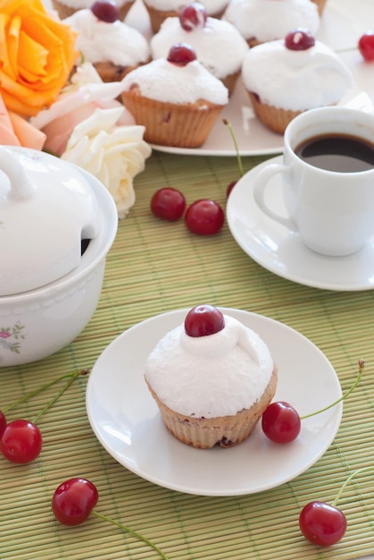 Breakfast cherry muffins with coffee