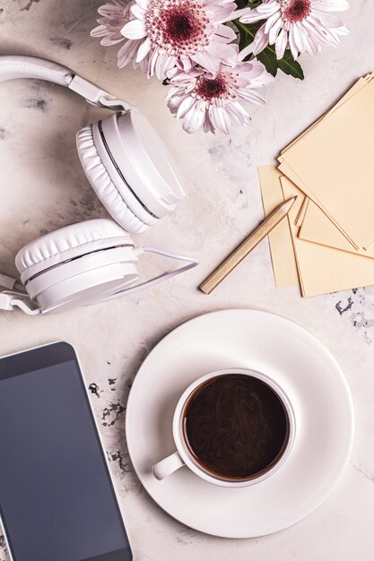 Breakfast - coffee, tephon, headphones. Top view with copy space.