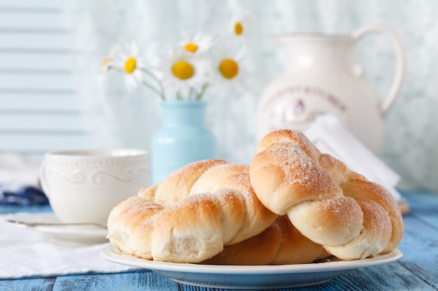 Breakfast in country house with cup of coffee and croissant