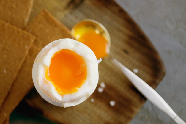 Breakfast. eggs soft-boiled on a gray background.