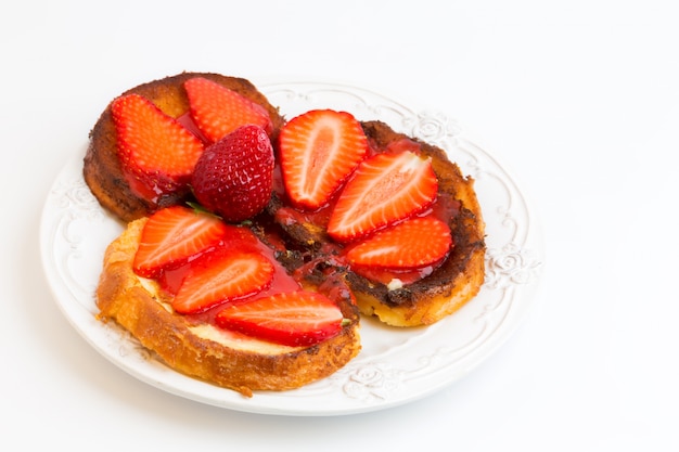 Breakfast French toast with strawberries isolated on white background