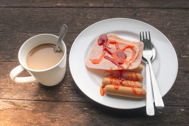 Breakfast Ham, Sausage and Coffee On a wooden background