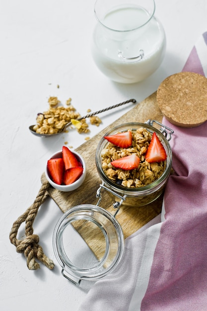 Breakfast includes organic granola, strawberries and yogurt. 