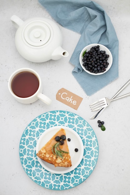 Breakfast is shot in flatlay style On the table is a dessert of cottage cheese cheesecake berries