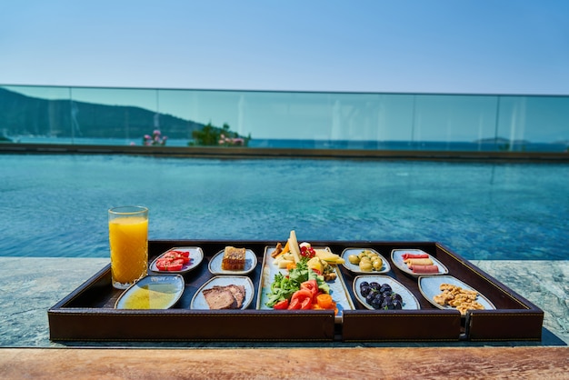 Breakfast in luxury hotel pool