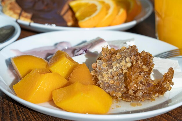 Breakfast of many dishes and drinks on a wooden table closeup Food concept