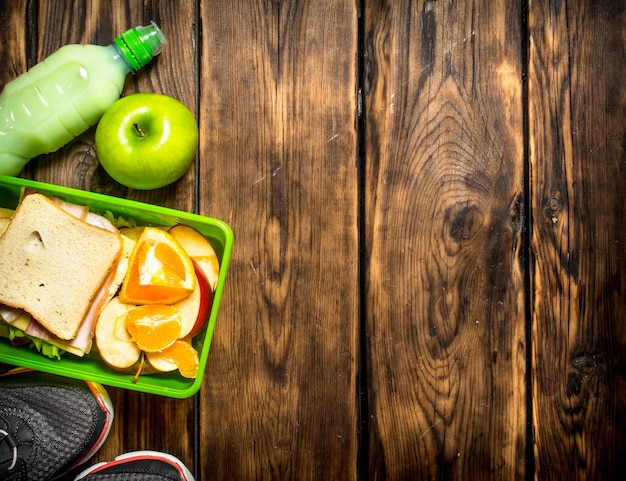 Breakfast in the morning. Sandwiches , fruit ,milkshake and sports sneakers