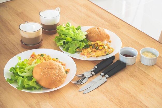 Breakfast Omelette Burger Salad served with coffee.