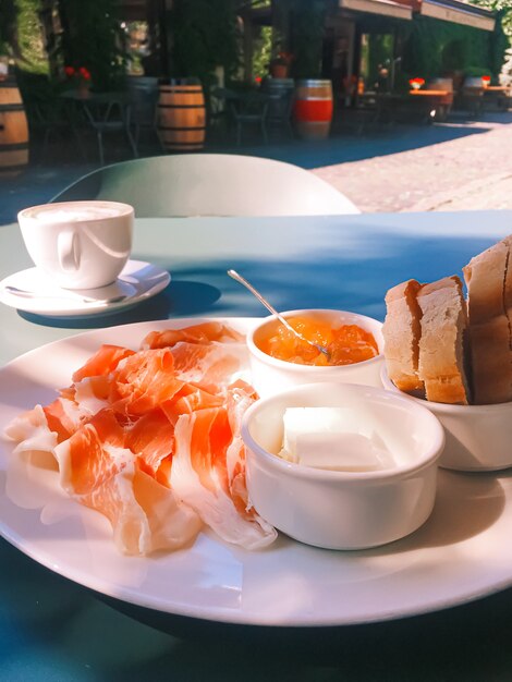 Breakfast outdoors in summer ham jam butter and ham