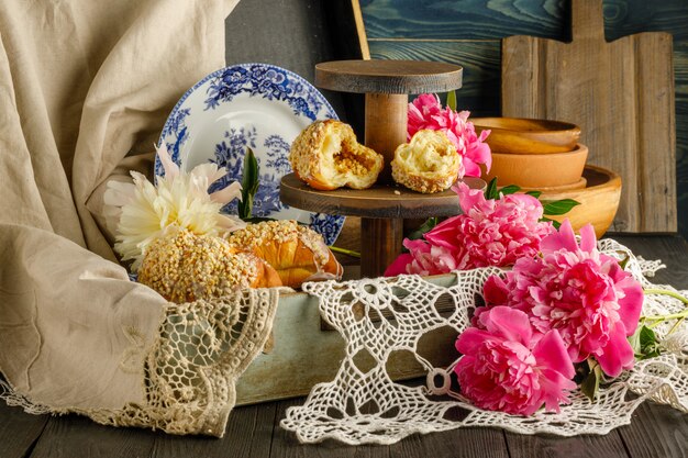 Breakfast pastries near peony flowers