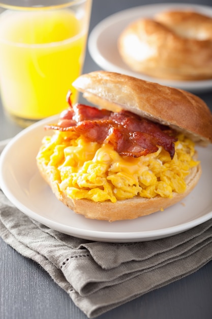 Breakfast sandwich on bagel with egg, bacon and cheese