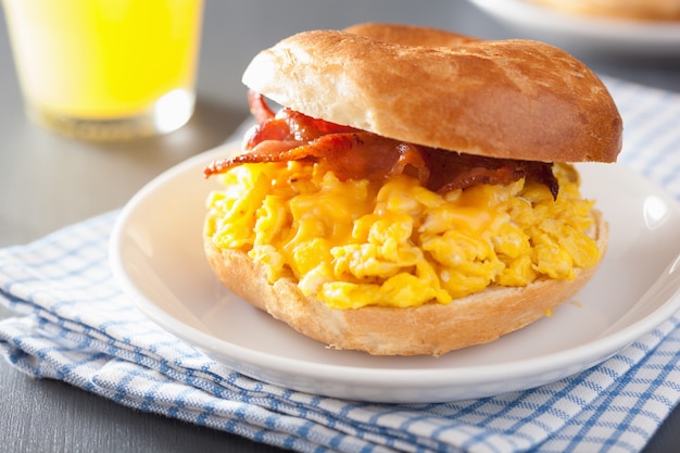 Breakfast sandwich on bagel with egg, bacon and cheese