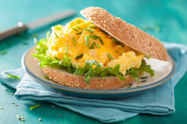 Breakfast sandwich on bagel with egg cheese lettuce