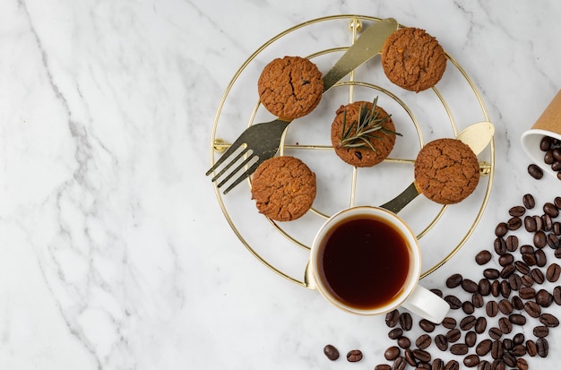 Breakfast Set Cookies and coffee on granite table background with copy space top view flat lay