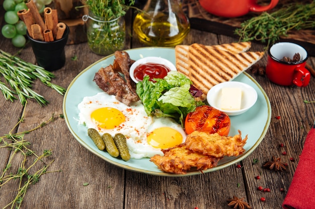 Breakfast set fried egg bacon potato pancake toast