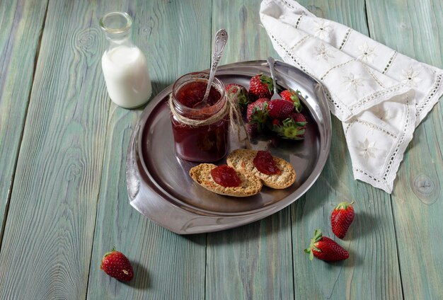 Breakfast of strawberry jam on rusks