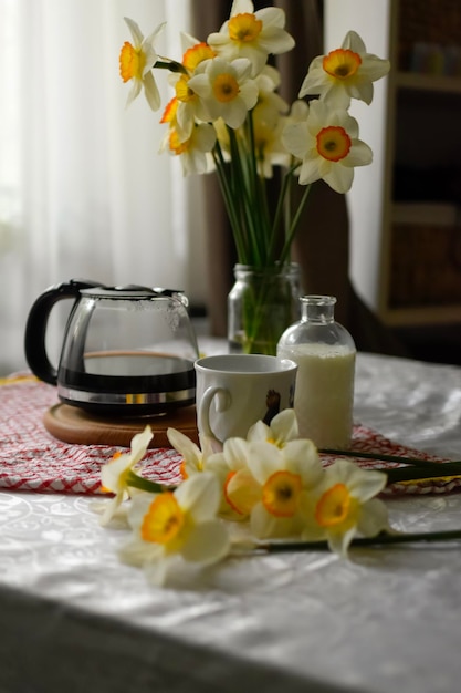 Breakfast table seating with coffee cup and milk