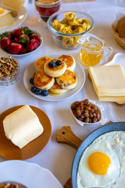 Breakfast on the table top viewFood on the table top viewMuesli with berries Fried eggsMeal day