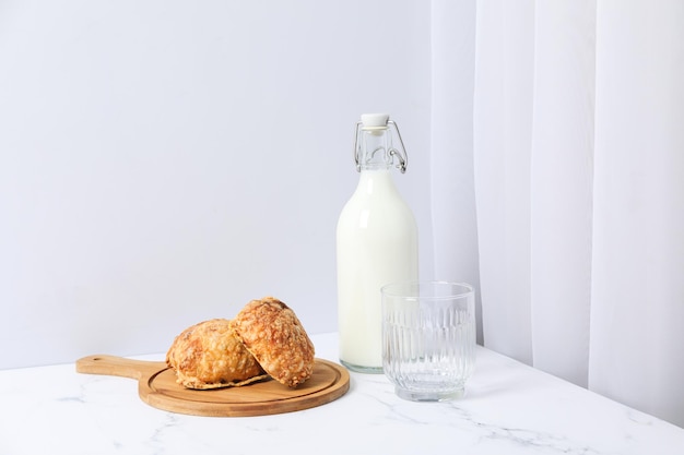 Breakfast tasty food concept milk with bakery products