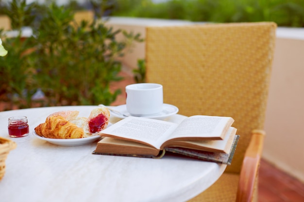 Breakfast on the terrace with an interesting book