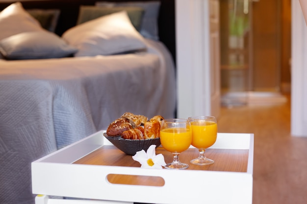 Breakfast on a tray by the bed at home