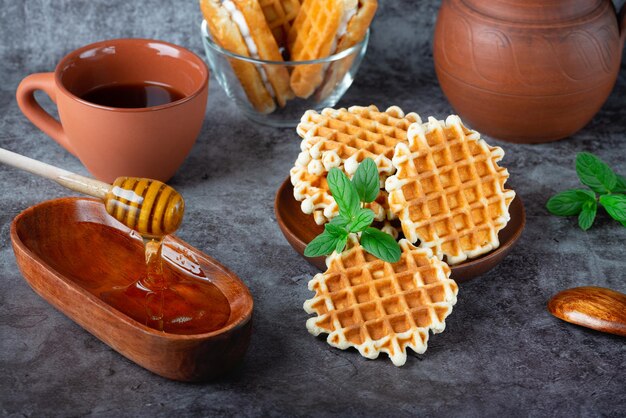 Breakfast with Belgian waffles honey and coffee