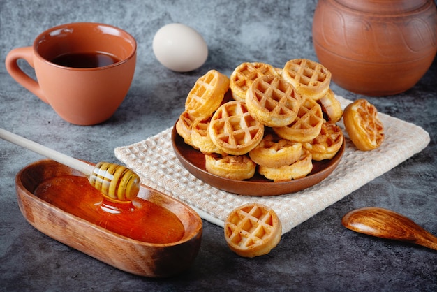 Breakfast with Belgian waffles honey and coffee