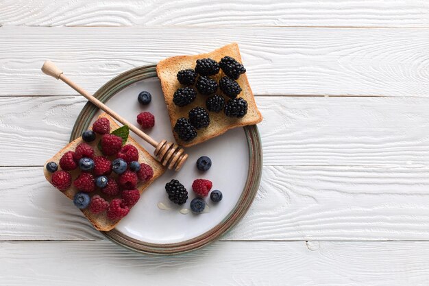 breakfast with berries on toasts