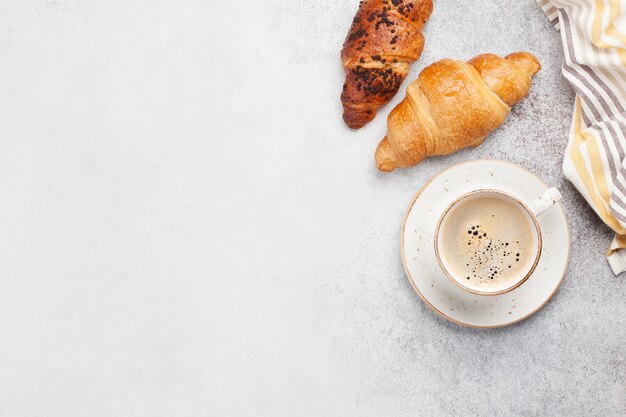 Breakfast with coffee and croissant