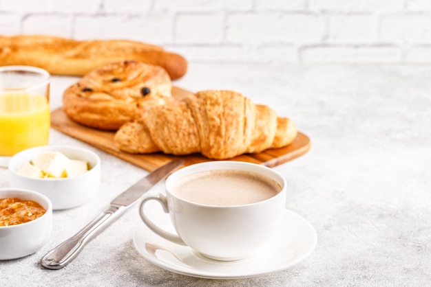 Breakfast with coffee and croissants