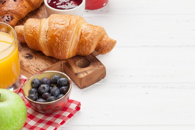 Breakfast with coffee and croissants